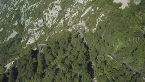 serbian mountain road with winding curves and cars