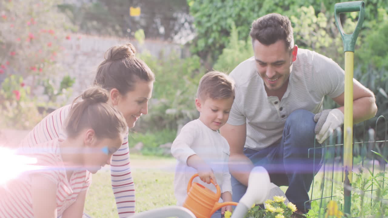 animación de puntos de luz sobre una feliz familia caucásica trabajando en el jardín