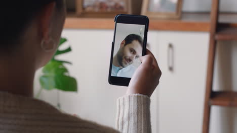 young-woman-having-video-chat-using-smartphone-at-home-chatting-to-boyfriend-showing-off-hairstyle-sharing-lifestyle-enjoying-long-distance-relationship