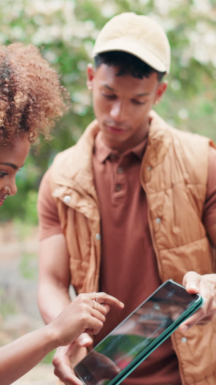 Young Woman Signs for Package on Tablet from Delivery Man