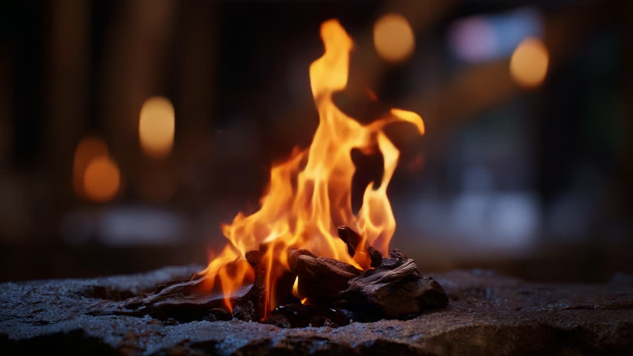 Captivating Flames Dance Over Logs: A Stunning Display of Fire's Natural Beauty Emphasized by a Softly Lit Background of Warm Ambience and Gentle Bokeh Effects