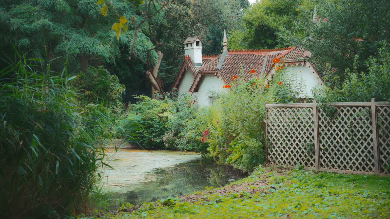 Picturesque Cottage by the Lake in a Lush Garden