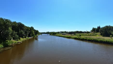 scenic view of the souris river, showcasing its calm waters and lush green vegetation