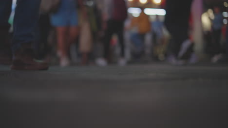 blurred crowd on city street at night