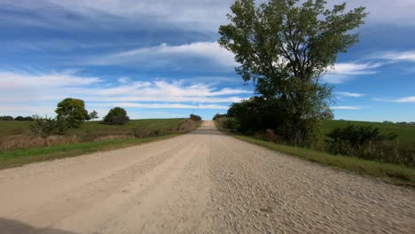 pov through driver's window while driving through rural iowa