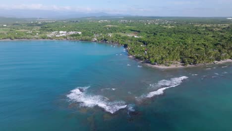 aerial view of playa palenque with beautiful coastline,blue caribbean sea and green rural landscape in background - san cristobal, dominican republic