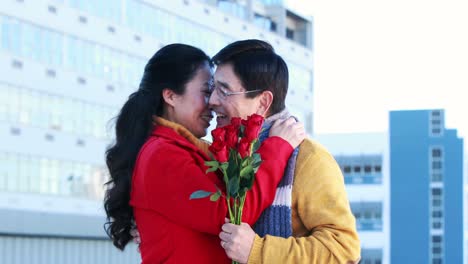 asian man giving roses to his wife