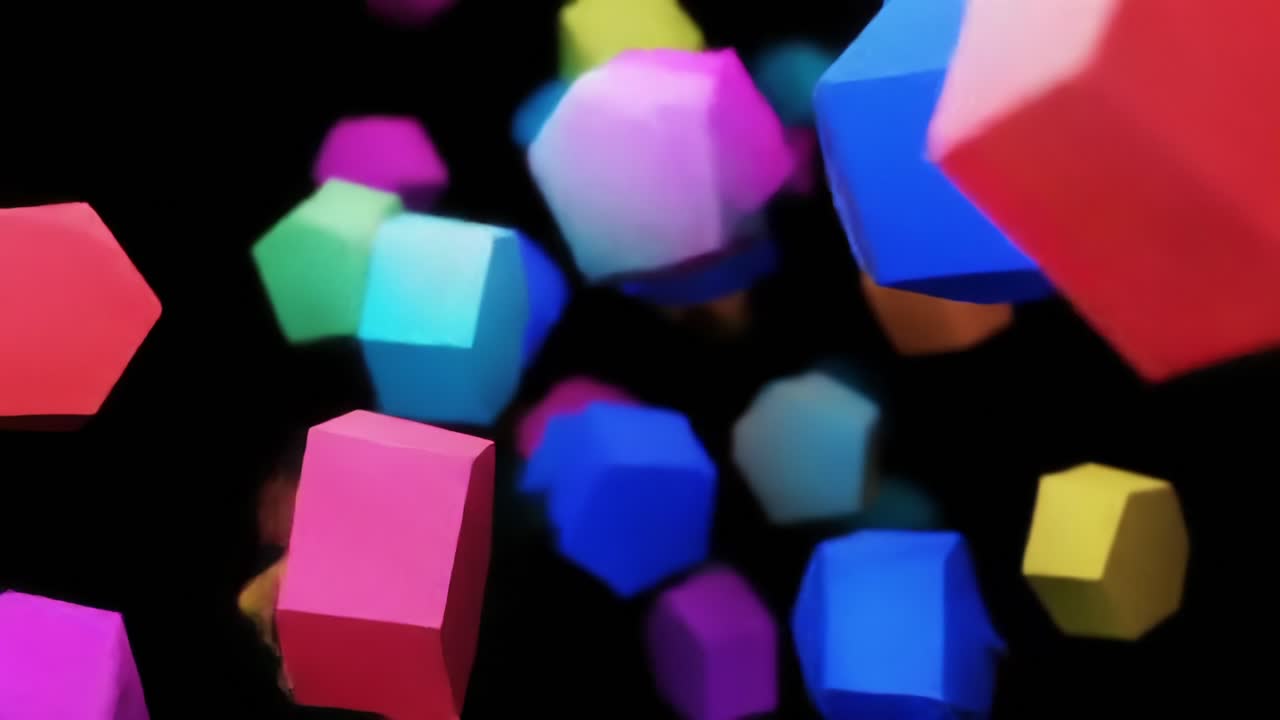 A Vibrant Display of Geometric Shapes Floating Against a Black Background, Showcasing Colorful Hexagons and Cubes in Dynamic Motion