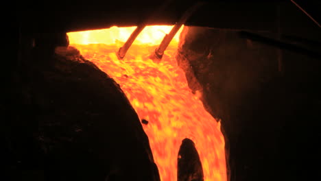 molten metal start pouring from blast furnace. metallurgical industry