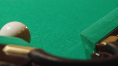 Playing American billiard poule close-up. Colorful balls on green billiards table .Billiard balls with numbers on a pool table. Billiards team sport.High quality 4k footage