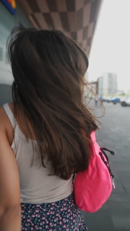 young woman walking outdoors