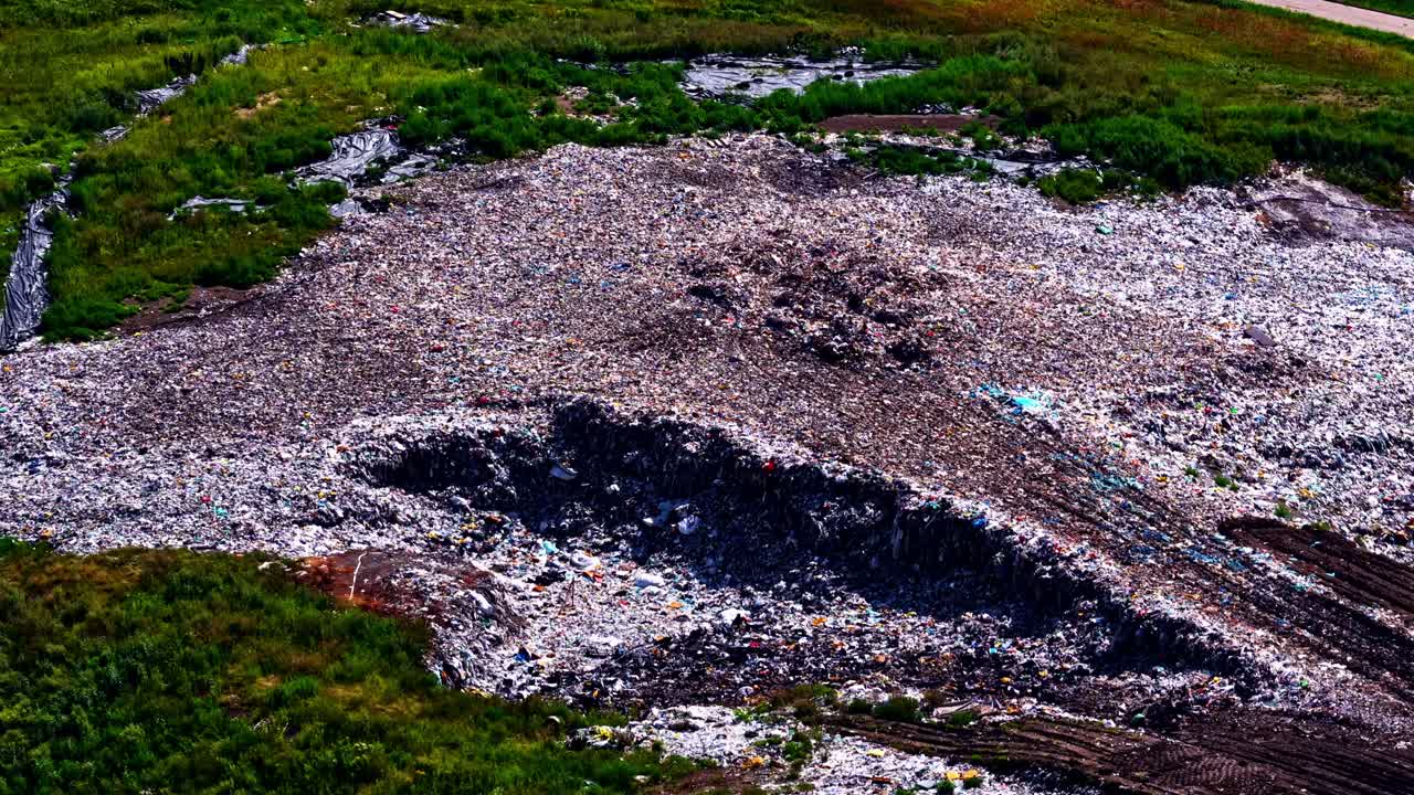 Large landfill garbage dump massive accumulation of waste materials environmental disaster