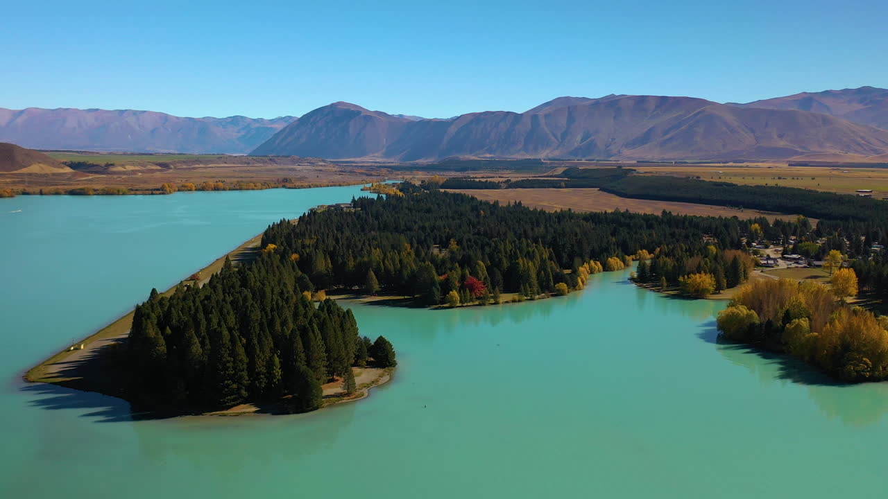 Scenic aerial flying over Lake Pukaki, New Zealand's South Island