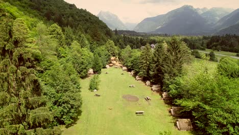 aerial view of summer camp with small camping cabins and recreational area.