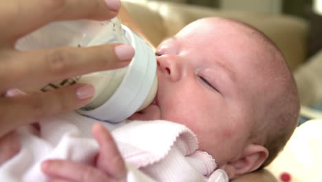 Baby-Being-Fed-With-Bottle-In-Nursery