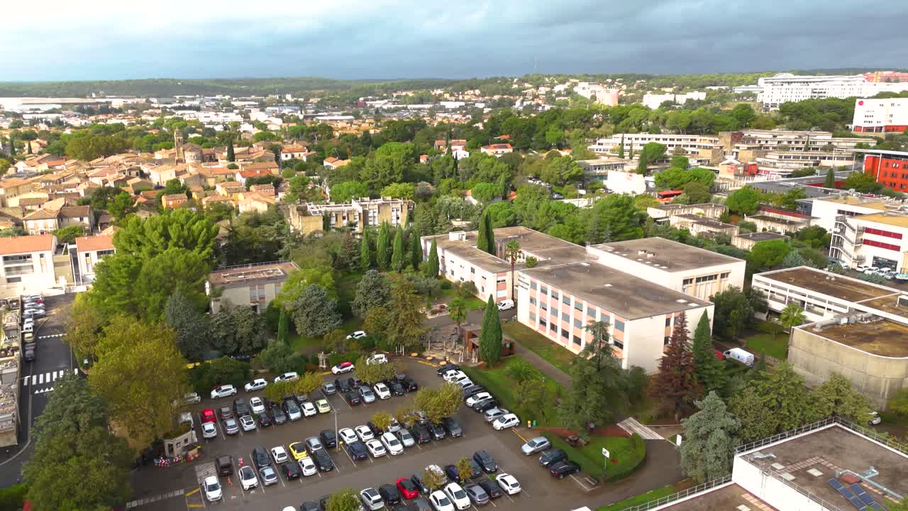 Aerial establishing shot of office buildings with car parks in Montpellier
