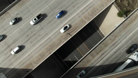 Awesome-Aerial-Looking-Down-and-Turning-Shot-of-Traffic-Over-I15-Freeway-in-Salt-Lake-Utah