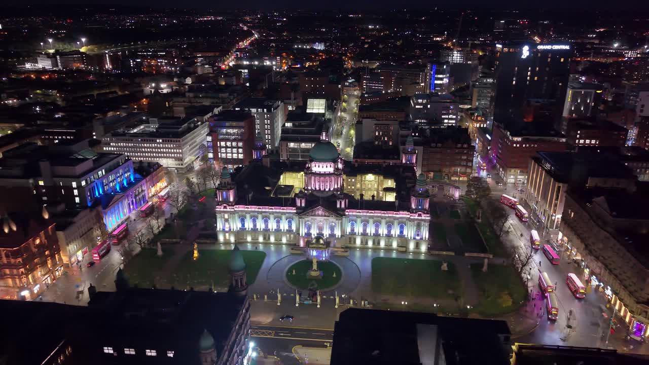 Anti-clockwise rotating 4K aerial of Belfast City Hall at night in Belfast, Northern Ireland in the UK. Produced in 50FPS and with Rec709 color