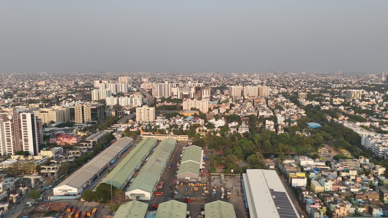Birds-eye view of an evolving cityscape with metro and mixed housing in Chennai.