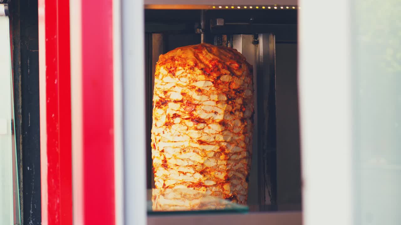 Stunning 4K video of a authentic turkish doner kebab rolling outside of a restaurant on the streets of Antalya, Turkey.