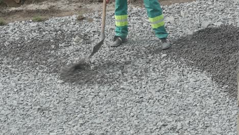 worker with shovel at construction works