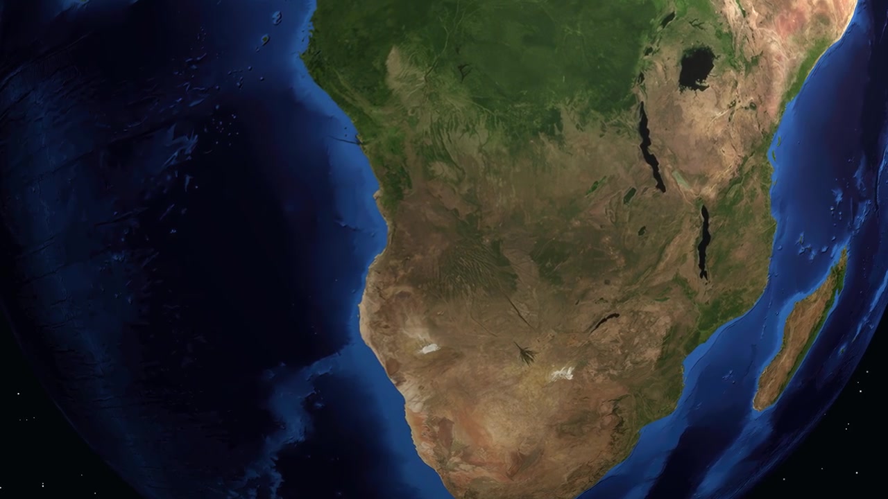 Un globo digitale ruota e zooma su Kuito, Angola, mostrando statistiche regionali e un segnaposto