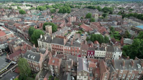 drone view of traditional brick townhouses in historic york, england