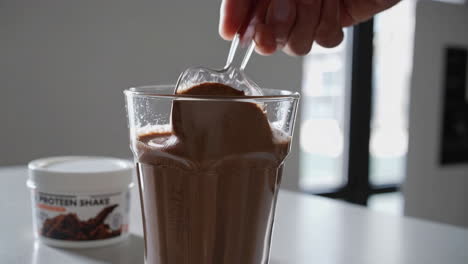 mixing a chocolate protein shake