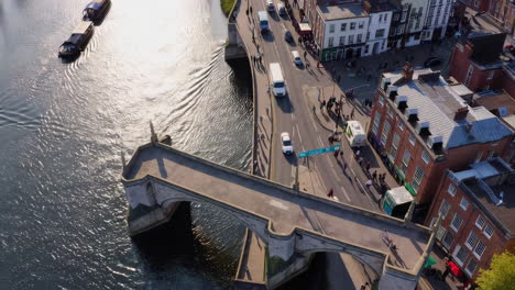 aerial view of a town with a bridge over a river