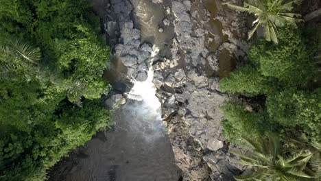 AERIAL-OVERHEAD-WATERFALL,-Tegenungan-in-Bali,-Indonesian