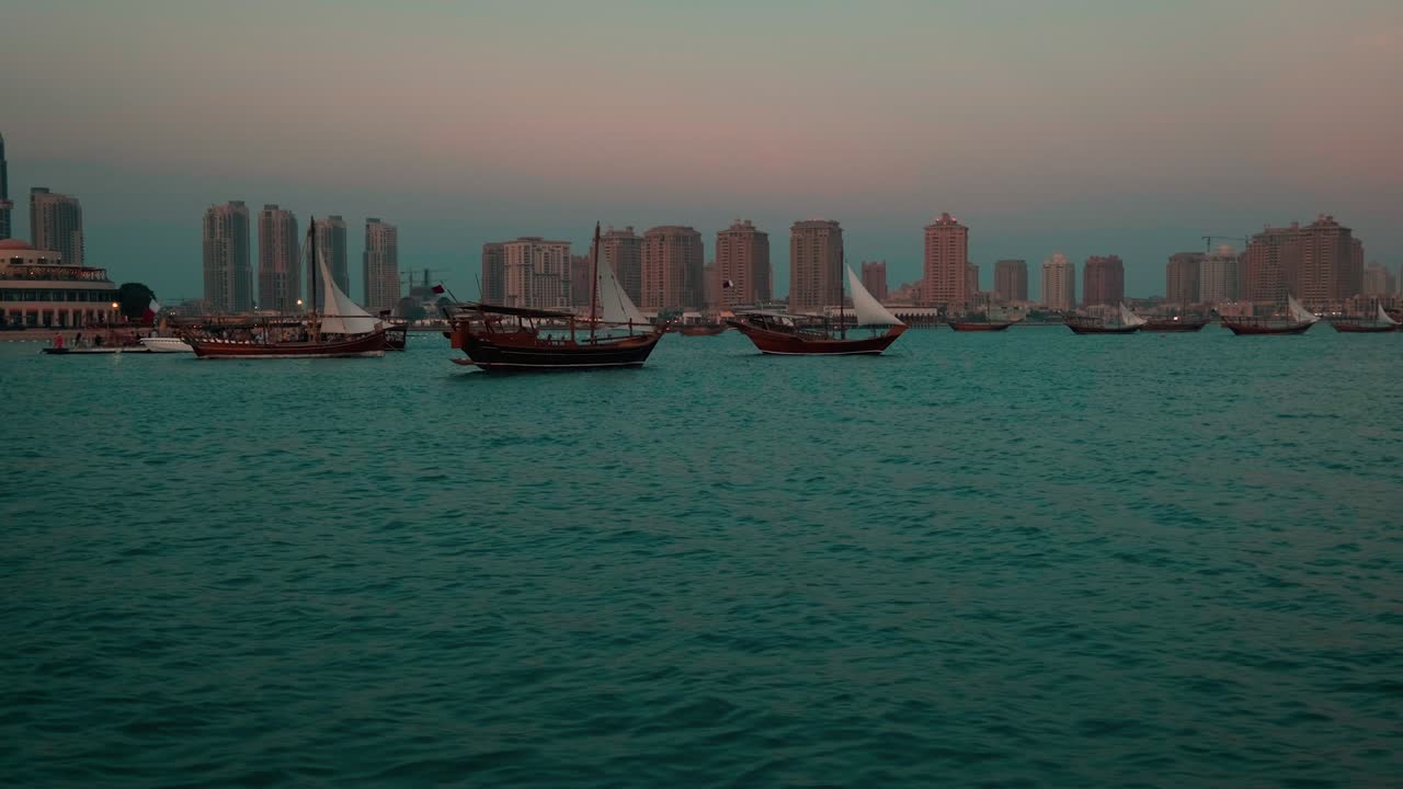 Dhows with Qatar Flag in Arabic gulf sunset shot