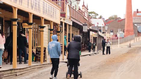 people walking in a historic town setting