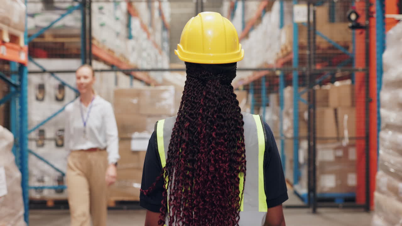 Warehouse workers in storage facility