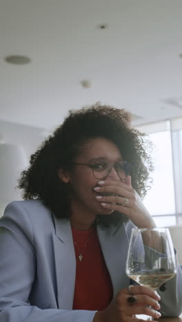woman enjoying a drink in a restaurant