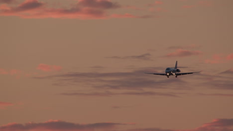 private jet landing at sunset