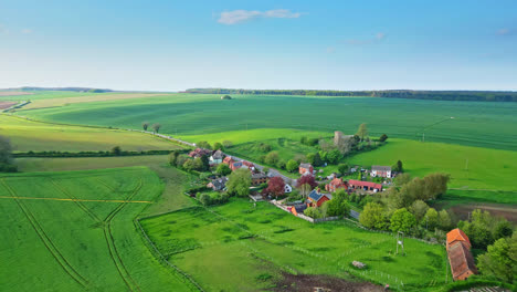 Drone-video-captures-Burwell-village's-transformation-from-medieval-market-town—countryside-fields,-old-red-brick-houses,-and-the-disused-Saint-Michael-parish-church-on-Lincolnshire's-Wold-Hills