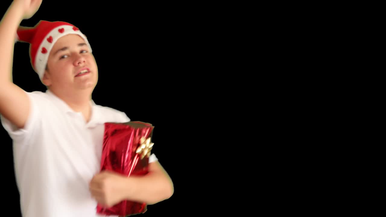 Young boy with Christmas present at green screen background 5