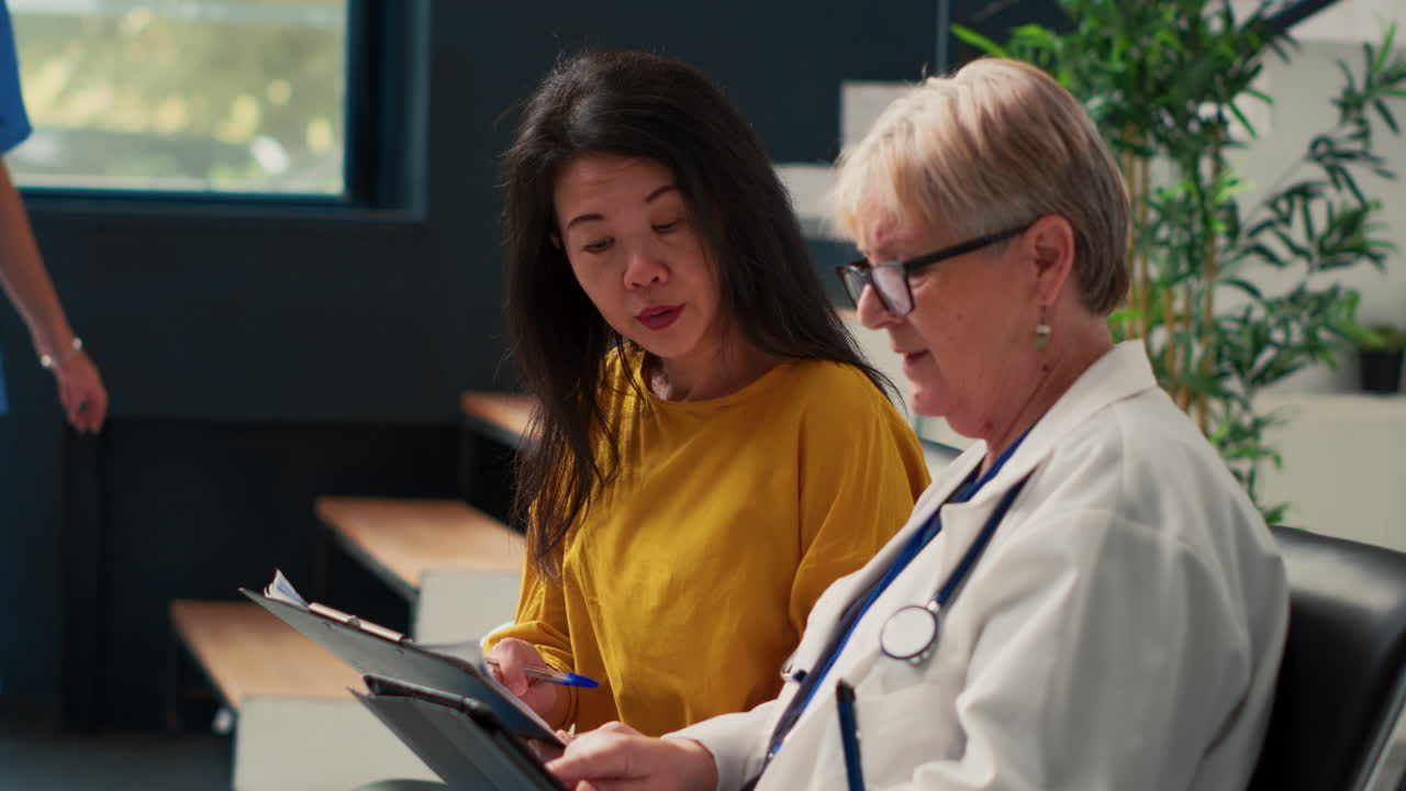 Doctor Consulting with Patient in Clinic