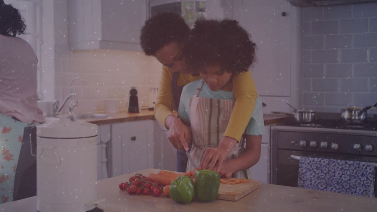 Woman guiding child chopping vegetables with floating social media icons tracking live feedback