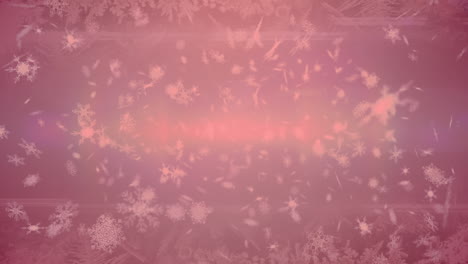 múltiples iconos de copos de nieve flotando contra el punto de luz sobre un fondo rojo