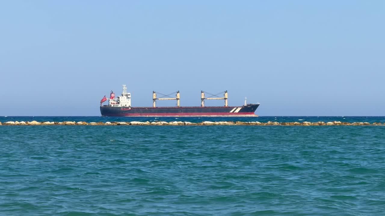Cargo Ship Anchored Off the Coast, Blue Sea and Sky STATIC