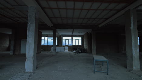overlook of the large premise in the building being constructed or reconstructed. interior with some debris and scaffolding.