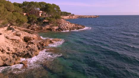 experience the beauty of cala rajada in mallorca with picturesque rocky shores and clear, inviting waters. this coastal area offers a serene escape, perfect for beach lovers and adventurers.