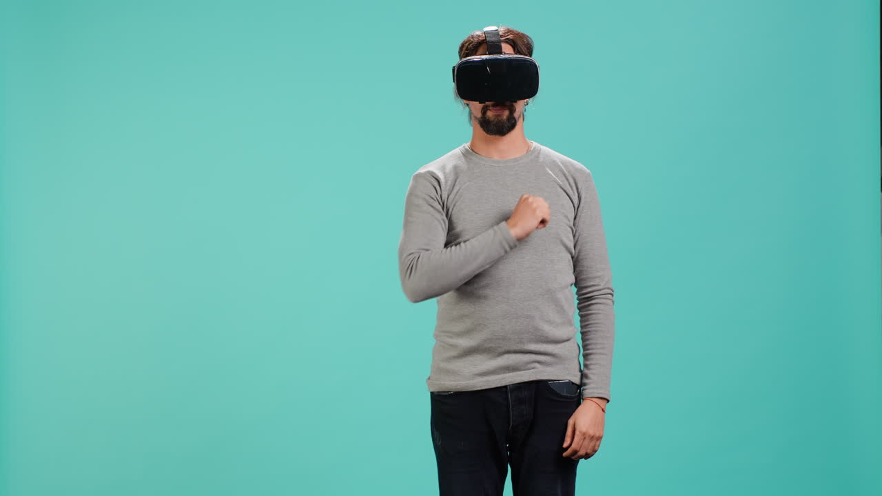 Tech enthusiast wearing virtual reality goggles, doing zooming