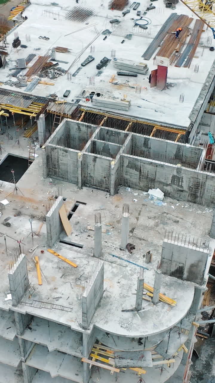 Construction of a residential apartment complex. Aerial view. Vertical video