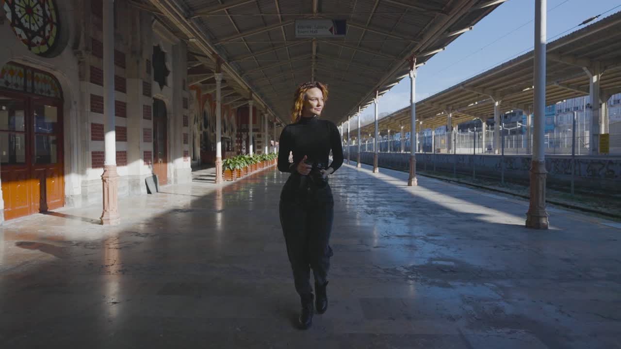 Woman walking at a train station
