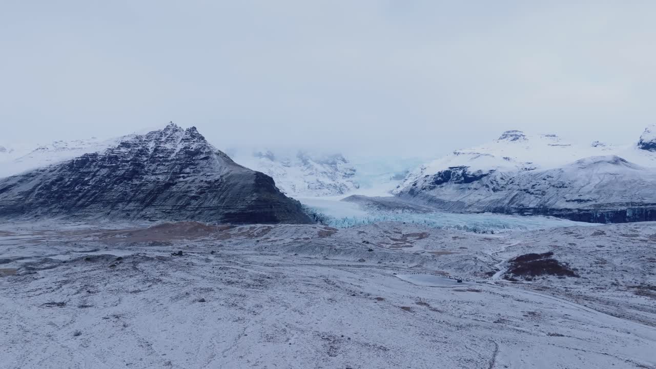 Vatnajokull glacier covered in mist, frozen Iceland majestic landscape - 4k aerial