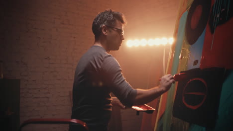 artist painting in studio