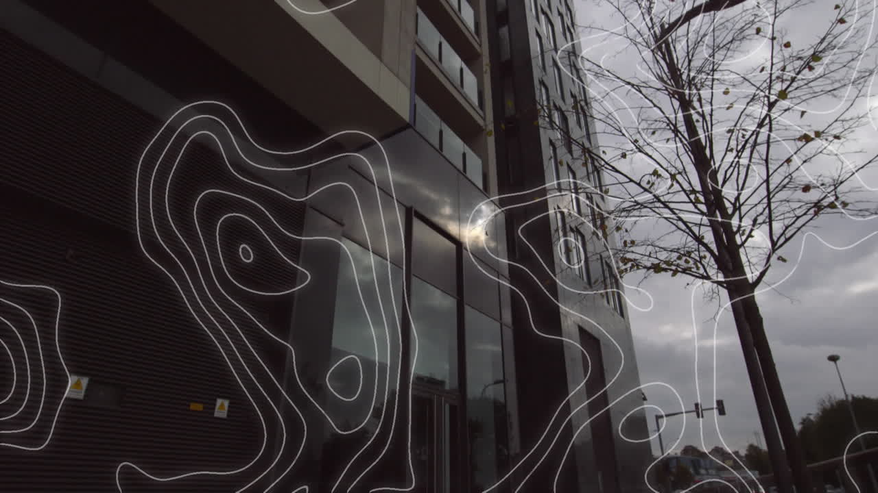 Digital composition of topography against tall buildings in background