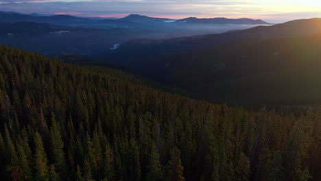 cinematic aerial drone sunrise morning sun flare fog denver front range foothills rocky mountains layers i70 idaho springs evergreen mount evans 14er wilderness squaw pass echo mountain forward motion